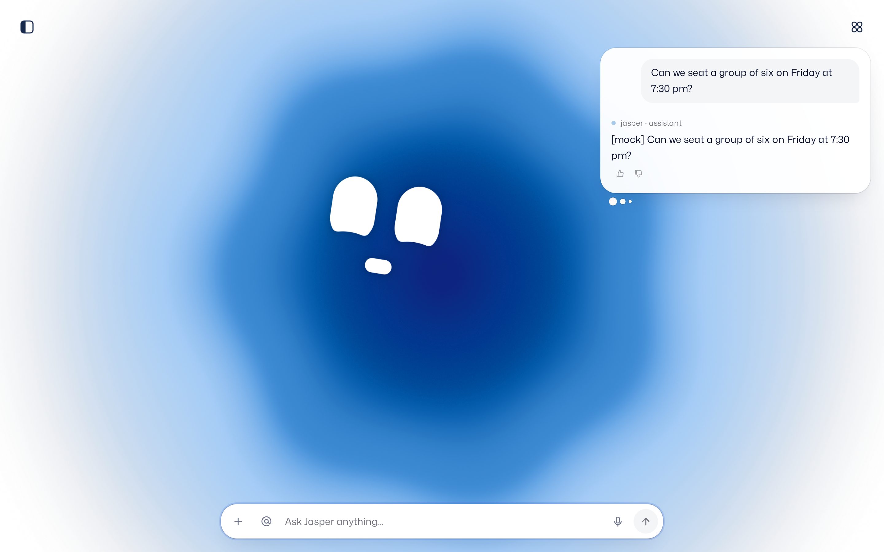 The chat with the assistant: the big blue character, the conversation card top right and the input bar at the bottom with attach, mention, microphone and send.